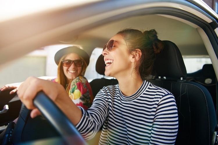 women driving happy